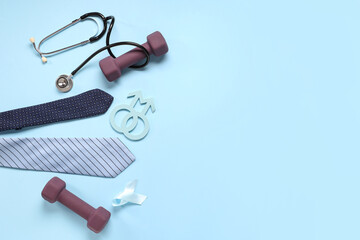 Tie, stethoscope, dumbbells, male sign and light blue ribbon on color background. Prostate cancer...