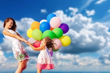 multi colored set of balloons at blue sky