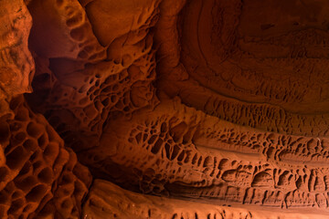 Red sandstones formations into the Foradada cave in the Areny mountain in Mont-Roig, Tarragona,...