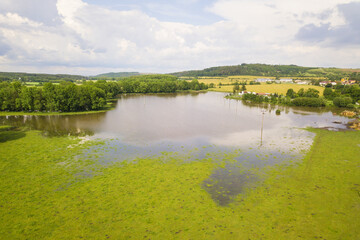 Flood in the countryside near the town Dobrany, West Bohemia, Czech republic, European union. Aerial view of flooded Radbuza river and landscape.
