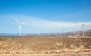 The Ghoubet wind power turbines generators of grid station farms standing at the sea, Arta Region,...