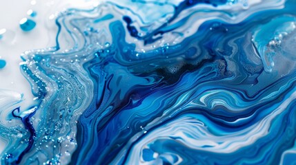 The smooth and glossy surface of a poured acrylic resin art piece resembling a glasslike finish