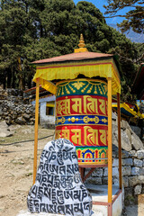 Nepal sacred stones mani with mantra written and carved on the surface. Prayer stones shire on the...