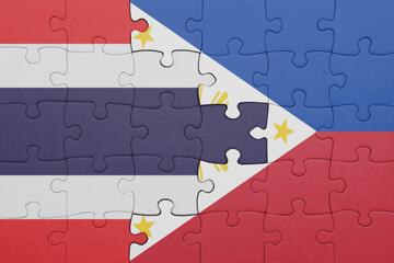 puzzle with the colourful national flag of thailand and flag of philippines .