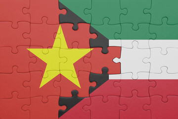 puzzle with the colourful national flag of vietnam and flag of kuwait .