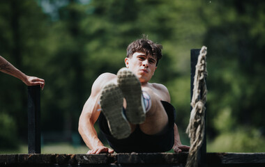A man exercises on a wooden bridge in nature, focusing on strength and fitness.