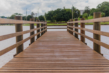 Wooden dock in front of a lake in a public park