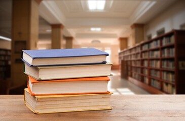 Book stack on the desk in public library