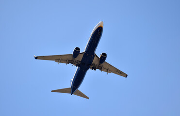 a plane flying over an airport