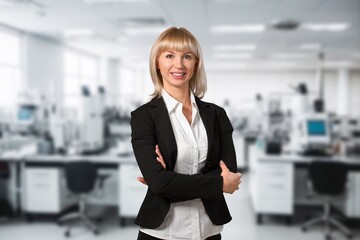 A bright and cheerful business woman in office