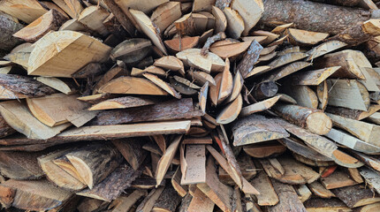 Stack of raw chopped forest wood for the oven