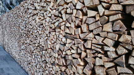 Stack of raw chopped forest wood for the oven