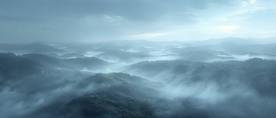 Obraz premium The fog envelops the scenery like a spectral veil, capturing the wide-angle view of the misty countryside at daybreak, serene and enigmatic, with its soothing colors and delicate illumination.