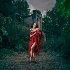Beautiful Model in Red Dress Posing in Natural Setting and 17th Century Ruins