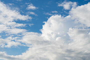 Blue sky with scattered white clouds