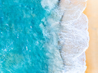 Amazing Top view sea beach landscape background,Summer sea waves crashing on sandy shore seascape background,High angle view ocean nature background
