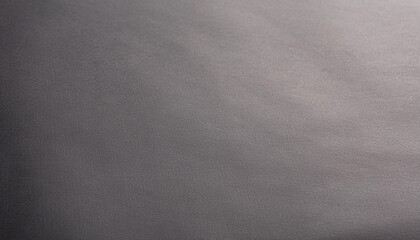 Naklejka premium textured black paper sheet close-up, showcasing its matte finish and subtle grain patterns, perfect for backgrounds, design elements, or artistic projects, highlighting depth and sophistication