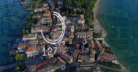 Image of financial data processing over cityscape