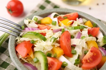 Tasty salad with Chinese cabbage in bowl on table, closeup