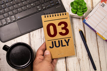 July 3. Wooden calendar with date