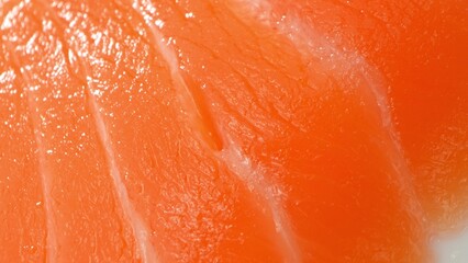 Astaxanthin-rich salmon slices, meticulously arranged, exhibit a tapestry of muscle fibers and...