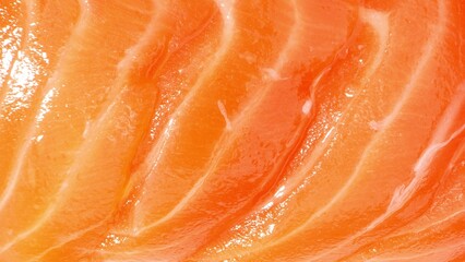 A mesmerizing close-up captures the delicate intricacies of thinly sliced salmon: vibrant orange hues of astaxanthin, intricate muscle fibers, and adipose tissue, all glistening with freshness.