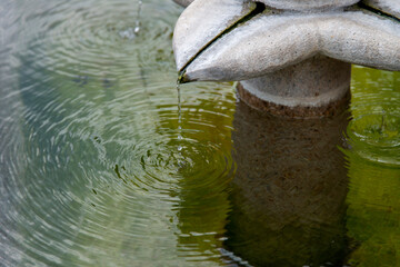 View of the flowing water on the fountain