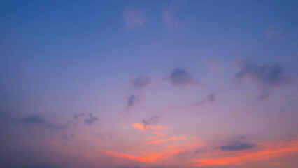 A tranquil sunset with a gradient sky transitioning from soft pinks and purples to deeper blues....