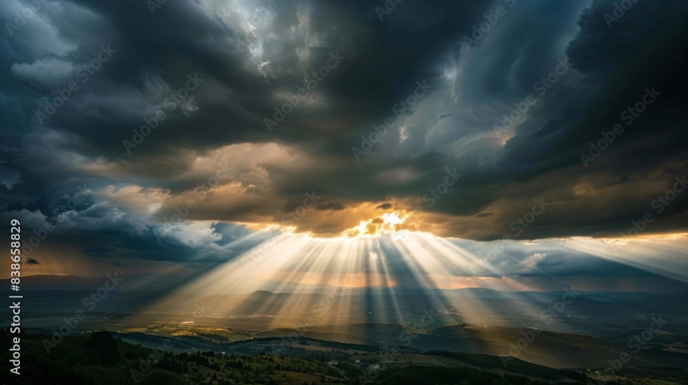 Poster sun rays piercing through dark storm clouds, illuminating the landscape with dramatic light and shad