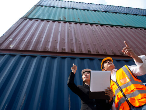 Top view supervisor manager staff employee labor white orange color hardhat helmet safety container cargo logistic warehouse import export trade technology delivery control freight factory shipping