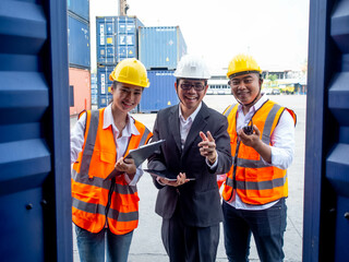 Labor employee manager supervisor male female woman man person people look at camera happy smile portrait work job occupation industry container engineer factory teamwork professional technology group