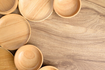 Kitchen utensils, wooden bowl, plate and dish on wooden background, Table top view