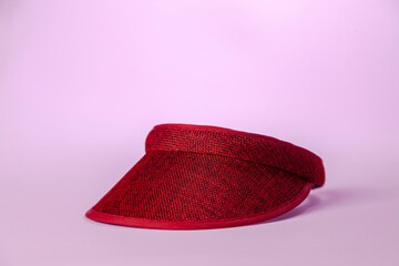Visor on pink background. Visor concept. Feminine product concept. Copy space.
