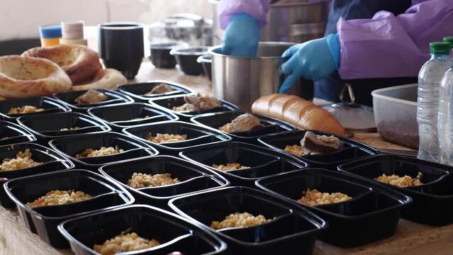 Volunteers distribute cooked hot meals to the seniors, elderly and other needy families