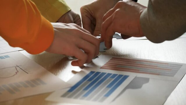 Applause as goal met, puzzle pieces united teamwork shines in success. Teamwork celebrated, puzzle completed, applause echoes achievement. Together puzzle solved teamwork triumph greeted with applause