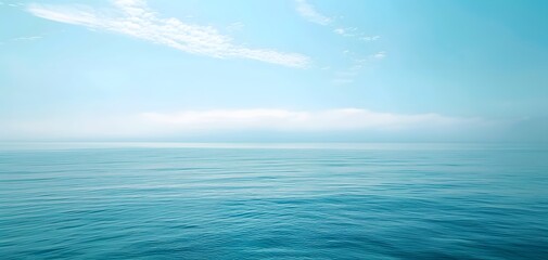 Obraz premium ocean water surface with cloudy blue sky. 