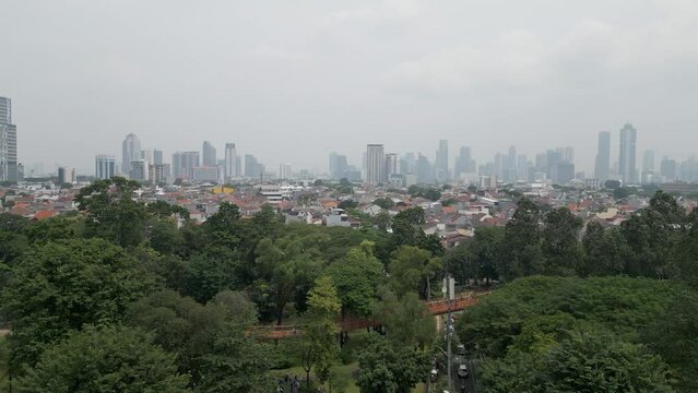 Aerial view of Tebet Eco Park from a residential area in Jakarta, Indonesia.