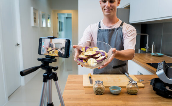 The chef is broadcasting live from workshop how to prepare a grilled eggplants with garlic