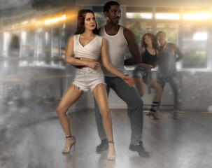 Expressive couple, attractive young brunette in white ripped shorts and top and sporty strong African American man dancing sensual kizomba in studio, captured with creative dramatic visual effects