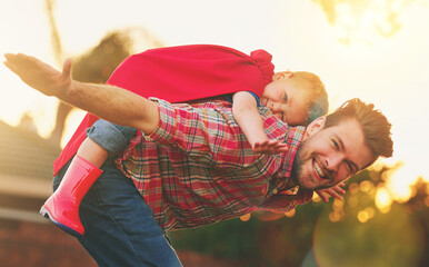 Child, man and piggyback for airplane in portrait for fun, fantasy or development in garden. Young...