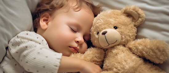 little boy fell asleep with teddy bear