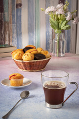 muffins with coffee and some flowers