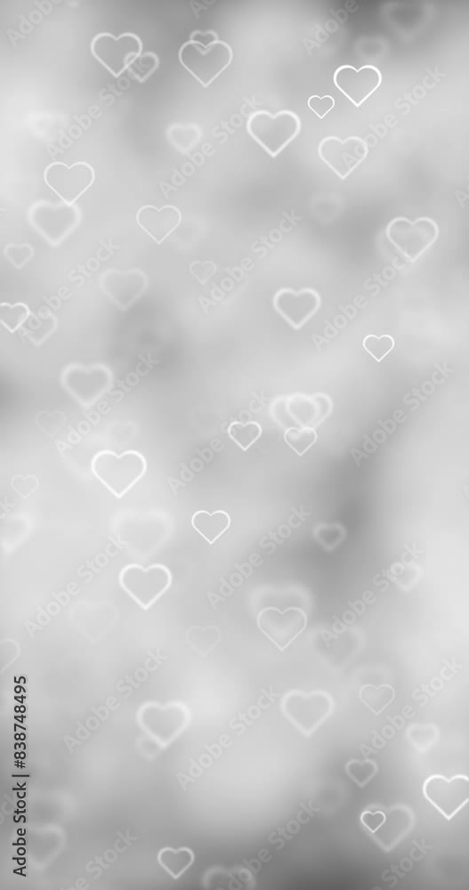 Poster silver white bokeh with heart shapes loop motion background.