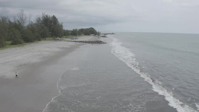 Establish aerial view of the Beach in Pariaman City, West Sumatra. d-log raw stock video