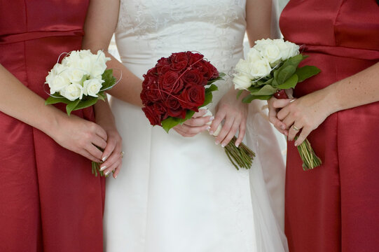 bride holding a bouquet of roses