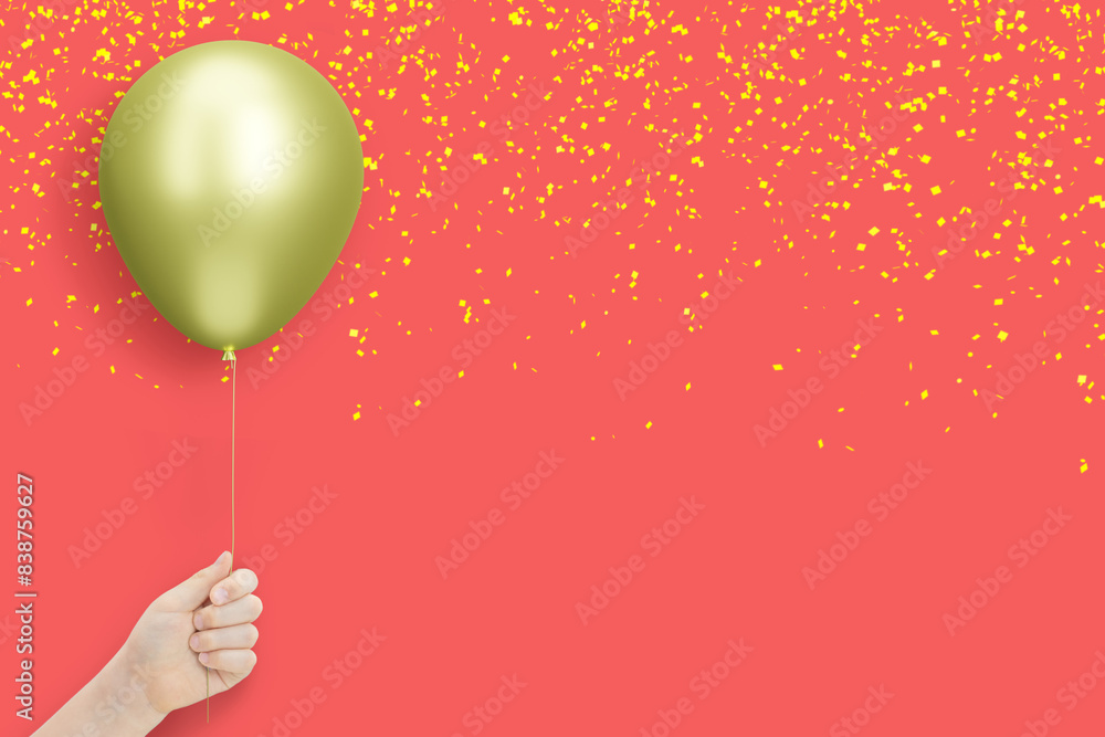 Poster female hand holds golden balloon on red background with confetti. empty space for text