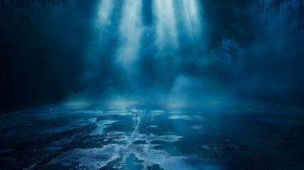 Dark street with wet asphalt and reflections of rays in the water