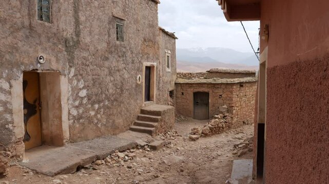 Pan right of apparently abandoned houses in Moulay Brahim Village, Morocco