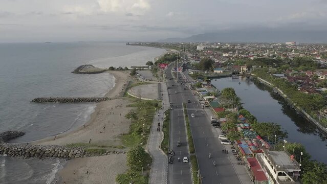 Establish aerial view of the Padang city landmark near the taplau coast of West Sumatra. d-log raw stock video