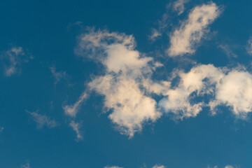 White clouds blue sky background.